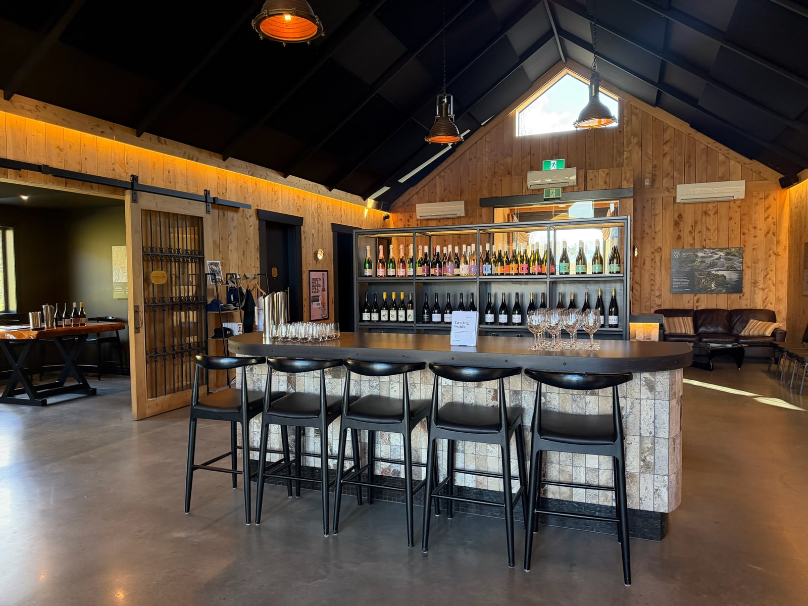 Wine tasting room and bottle display at Kinross in Central Otago