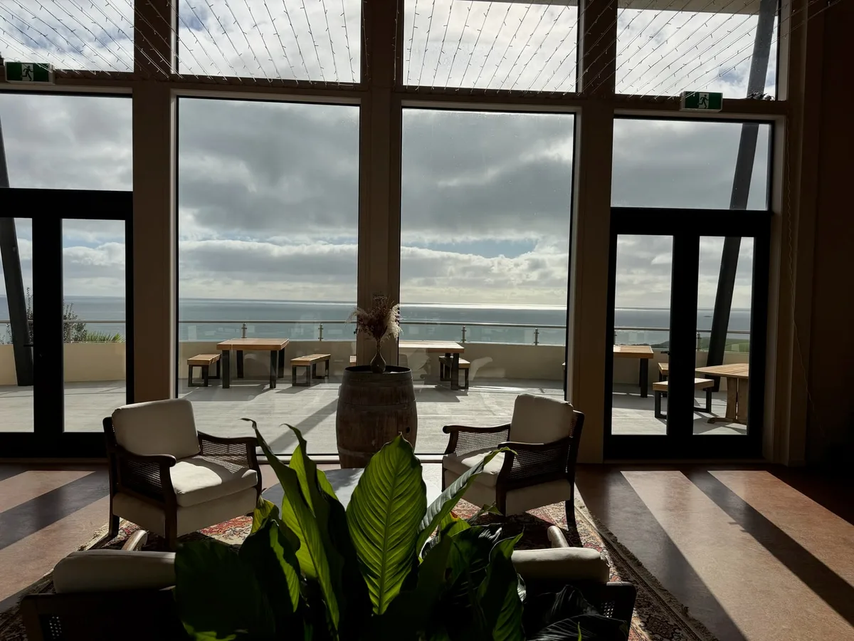 Seating and coastal views from inside Okurukuru winery