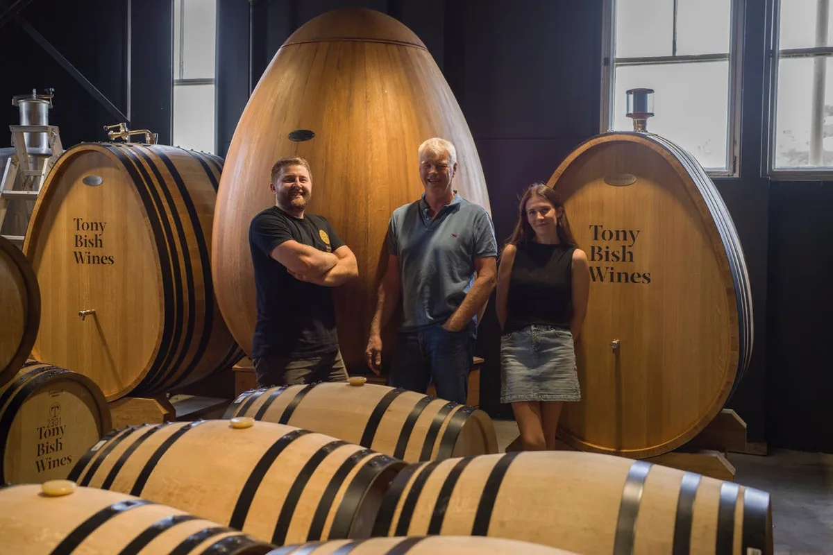 Tony Bish Wines cellar with winemakers and oak vessels