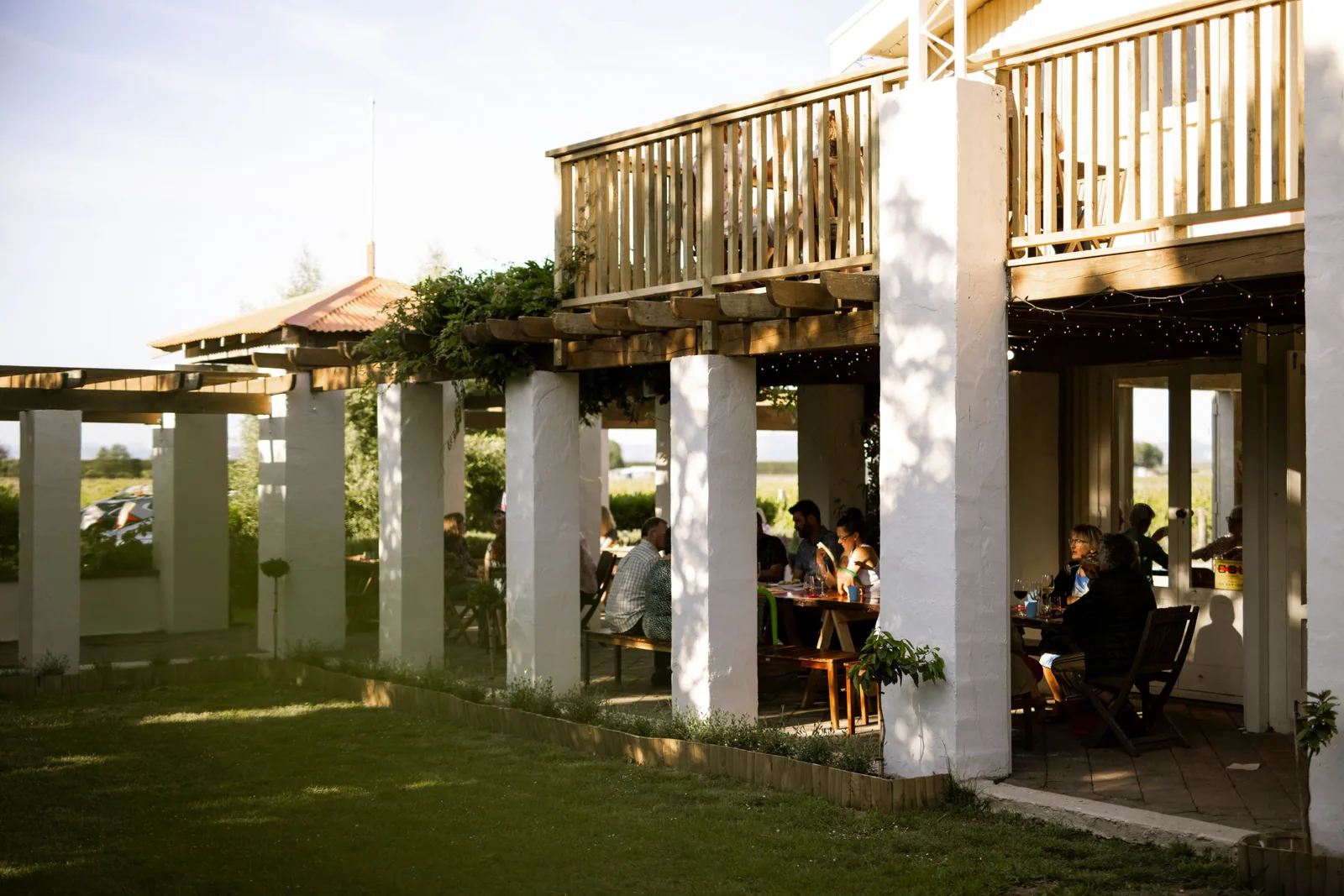 Visitors seated on the terrace at Wrights Vineyard and Winery