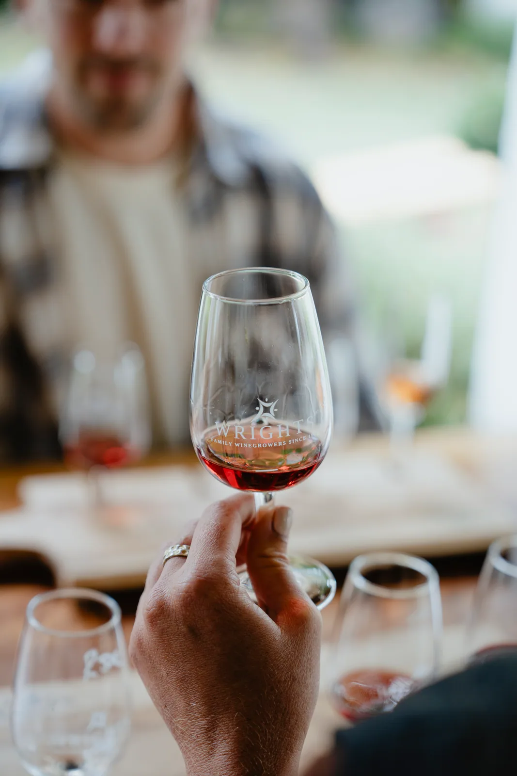 A glass of red wine during a Wrights Vineyard tasting